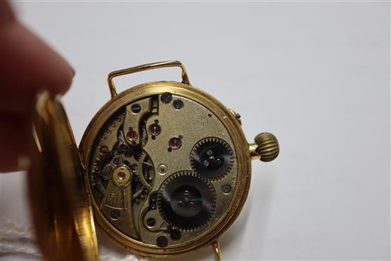 A gentlemans early 20th century 18ct gold manual wind wrist watch, with Roman dial and case back inscription,